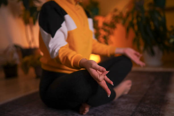 istock Sitting and meditating at home 1348938700