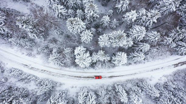 istock Car driving on winter country road 1348940377