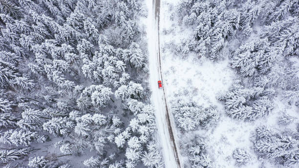 istock Car driving on winter country road 1348940399