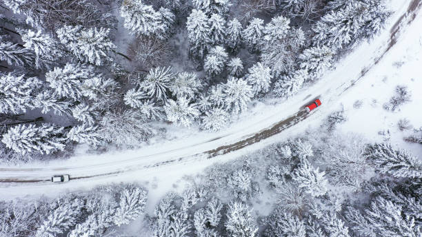 istock Car driving on winter country road 1348940410