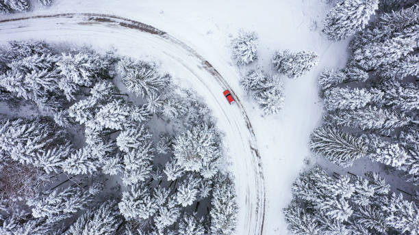 istock Car driving on winter country road 1348940447