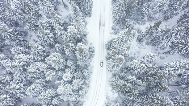 istock Car driving on winter country road 1348940459