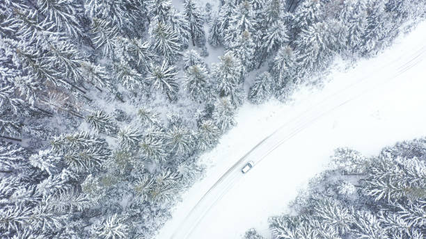 istock Car driving on winter country road 1348940471