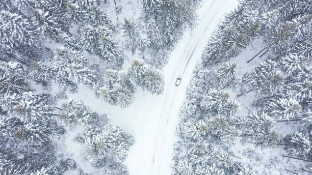 istock Car driving on winter country road 1348940493