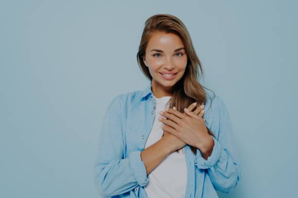 istock Friendly looking beauitiful female expresses her love to everybody 1348941819
