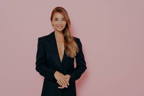 istock Confident boss lady smiling on pink background 1348941850