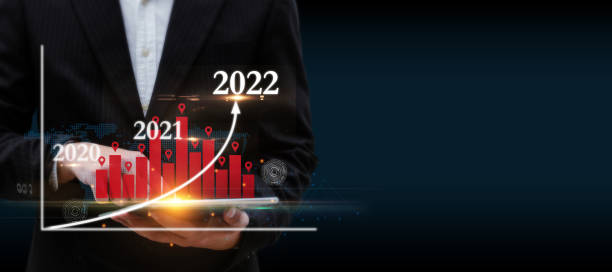 istock businessman using digital mobile tablet with graphic candle stick population chart hologram on dark background, population community growth, stock market, investment and financial business concept 1348942563