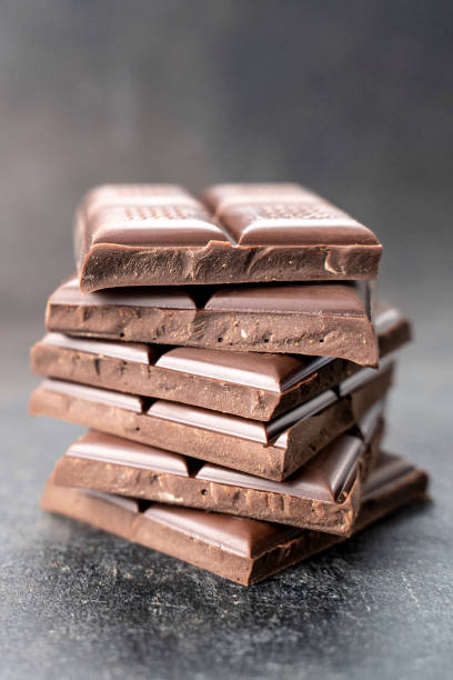 istock Chocolatier preparing chocolate tower pieces chocolates. recipe Cooking handmade chocolate bar, dessert, candies 1348942580