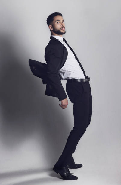 istock Studio shot of a young man posing against a grey background 1348944251