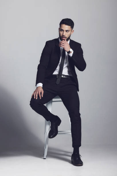 istock Studio shot of a young man posing against a grey background 1348944259