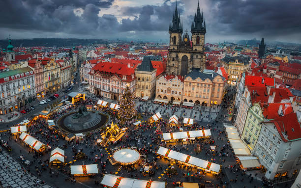 Panoramic view of the traditional winter Christmas Market in Prague Panoramic view of the traditional winter Christmas Market for the festive season at the old town square of Prague, Czech Republic prague christmas market stock pictures, royalty-free photos & images