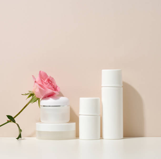 istock empty white plastic tubes and jars for cosmetics. Packaging for cream, gel, serum, advertising and product promotion 1348953504