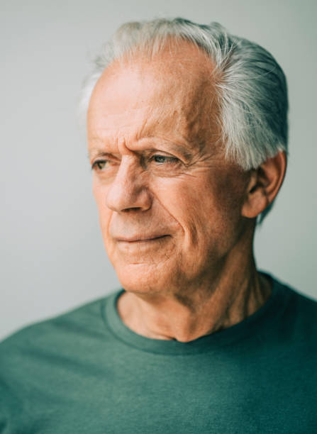 istock Serious senior man looking away 1348958518