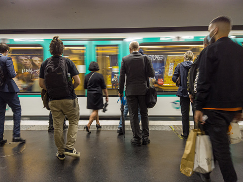 Passangers awaiting for a train in Paris Metro. Paris, France - 12 September 2021
