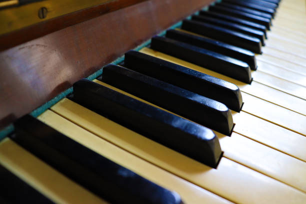 istock Close up of an old piano keyboard. 1348959770
