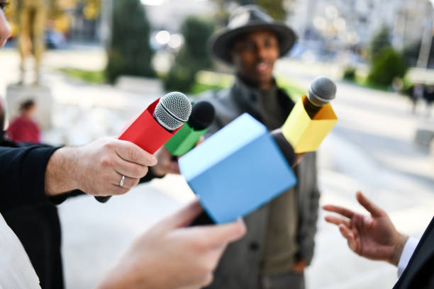 istock Journalists Offering Interview Chance In City Center Outside 1348963495