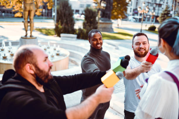 istock Famous Female Giving Interview For Multiple Journalists In City Center 1348965498