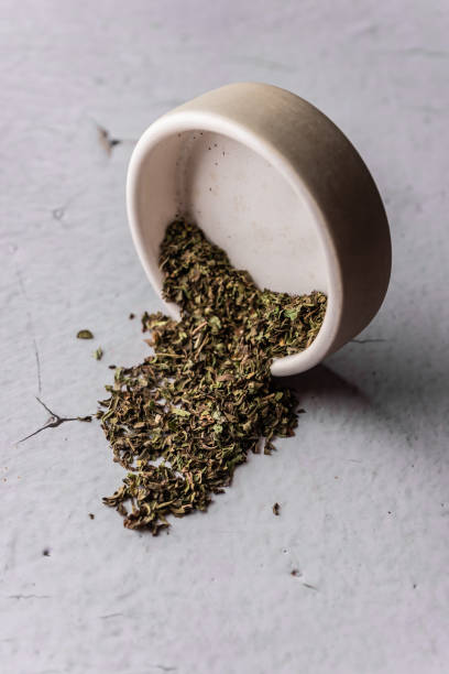istock selective focus, natural green leaf tea in a clay bowl 1348965811