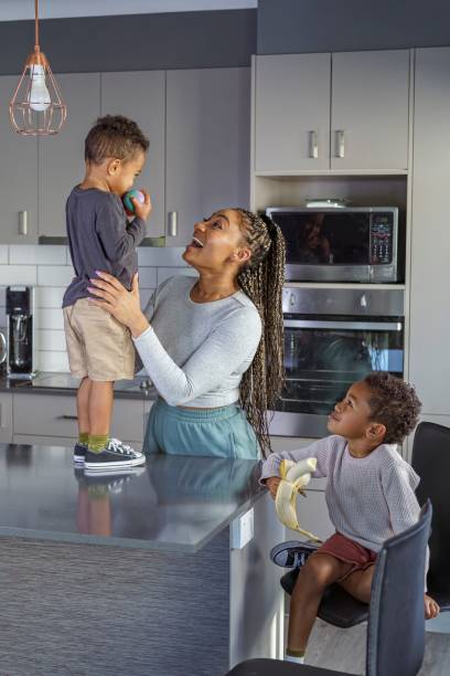 istock Loving mom enjoying time at home with her sons 1348966608