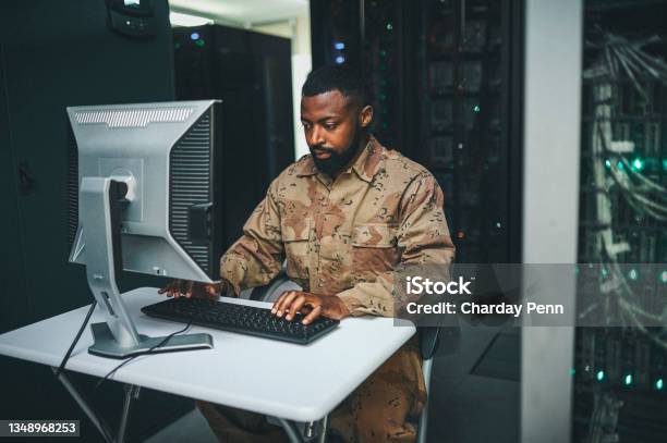 Shot Of An Male It Technician In A Server Room And Using A Laptop Stock Photo - Download Image Now
