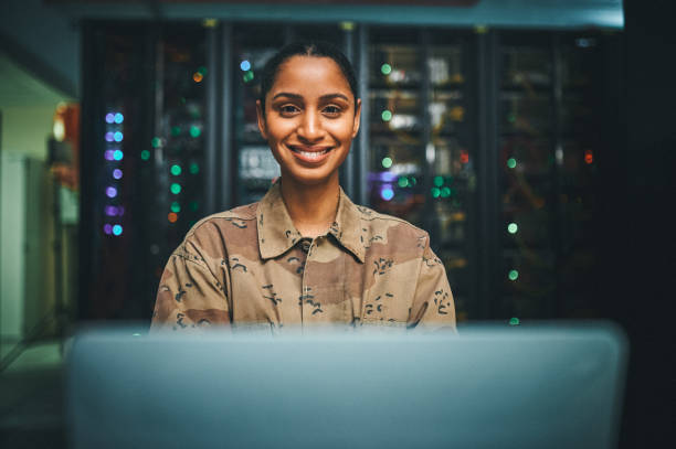 istock Shot of an female IT technician  in a server room and using a laptop 1348968291