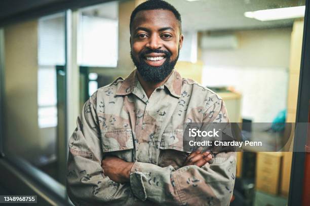 Shot Of A Male Soldier Standing In A Office Room Stock Photo - Download Image Now - Army, Men, Officer - Military Rank
