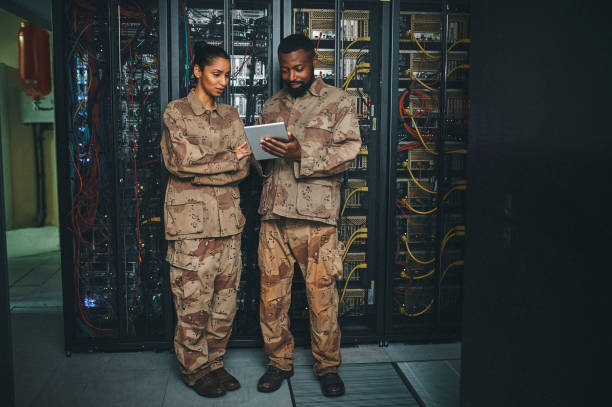 istock Shot of a two IT technicians working in a server room 1348968761