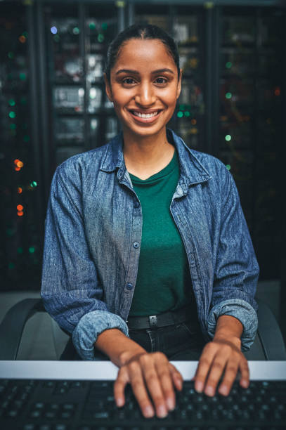 istock Shot of an female IT technician  in a server room and using a laptop 1348968804