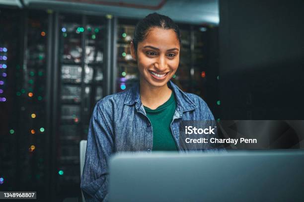 Shot Of An Female It Technician In A Server Room And Using A Laptop Stock Photo - Download Image Now
