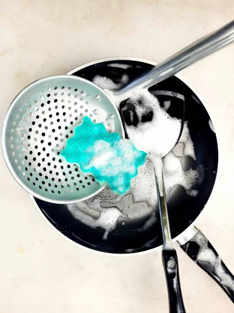 Cleaning Cooking pan and Kitchen utensils.