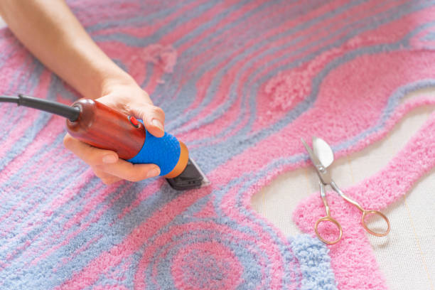 Making a wall rug by hand.  Art of manual tufting. stock photo