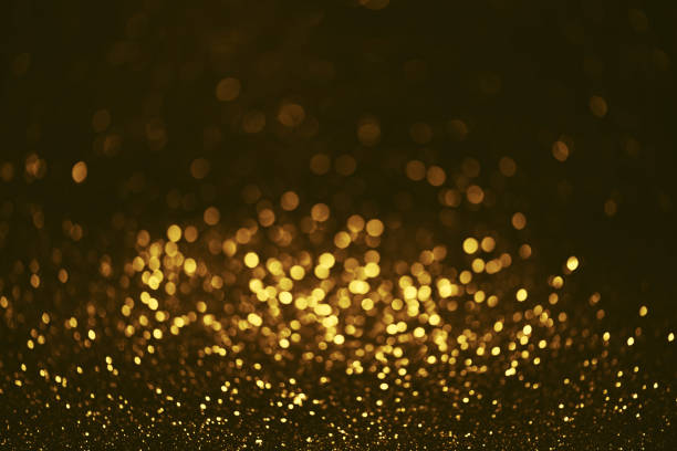 istock Golden glitter bokeh lighting texture Blurred abstract background for birthday, anniversary, wedding, new year eve or Christmas 1348973460
