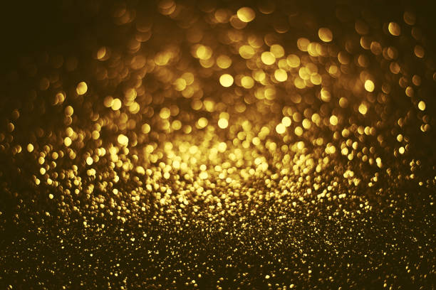 istock Golden glitter bokeh lighting texture Blurred abstract background for birthday, anniversary, wedding, new year eve or Christmas 1348973478