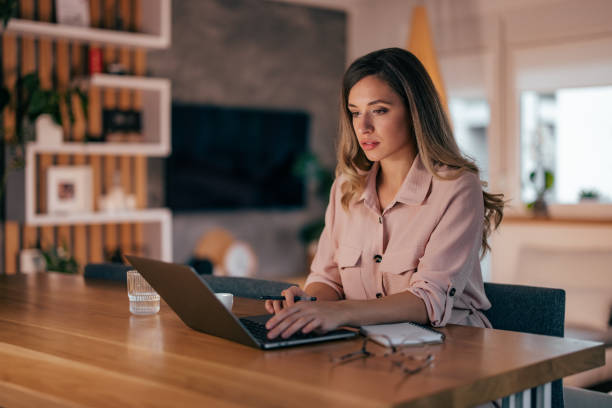 istock Young businesswoman, joining a conference call. 1348975328