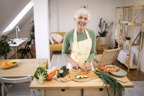 istock Woman preparing healthy meal 1348976814
