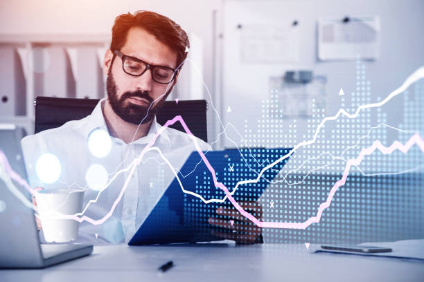 istock Businessman wearing white shirt is reading document on clipboard 1348979350