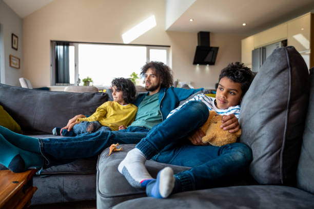 istock Family Relaxing on the Sofa 1348979597