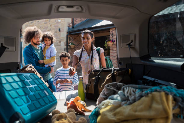 istock Family Unloading the Car 1348979847