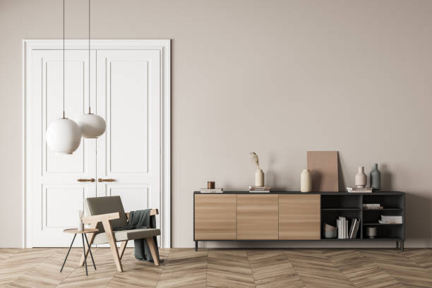 istock Bright living room interior with empty wall, armchair, doors 1348980087