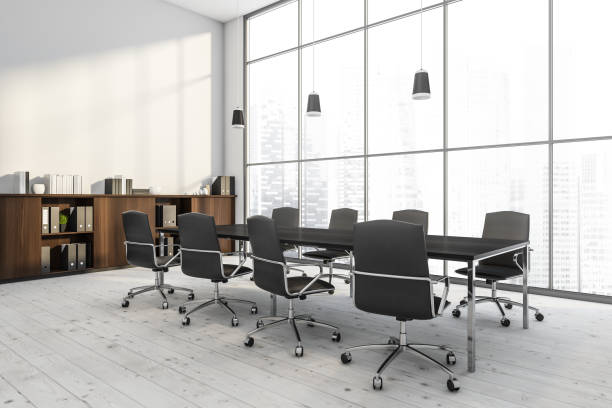 istock Panoramic white office with confrernce table and pendant lights. Corner view. 1348982039