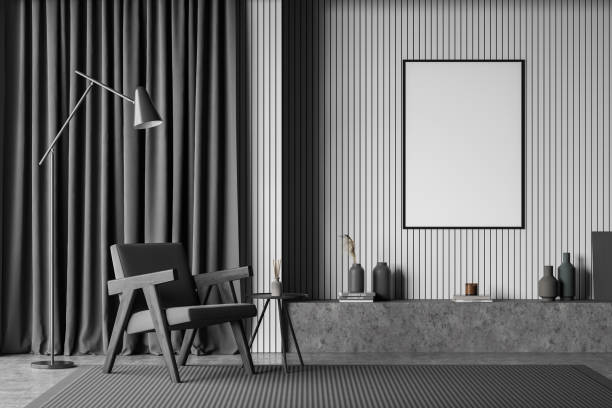 istock Dark living room interior with white empty poster, armchair 1348982917