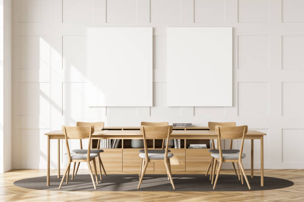 istock Two empty canvases on white living room wall and table 1348983694