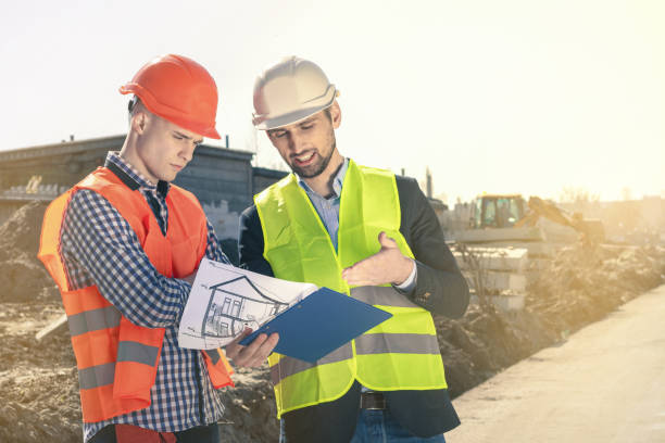 istock Construction Supervisor Supervises the pouring of concrete pump at construction site. 1348983738