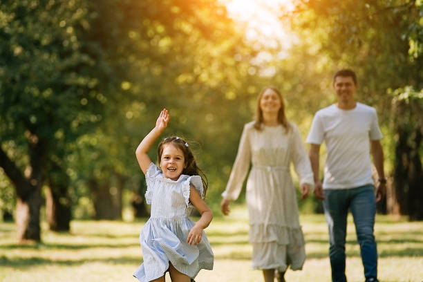 istock Family walking in the park 1348988234