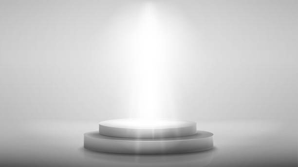 istock White scene with gray podium with lighting of spotlights 1348992500