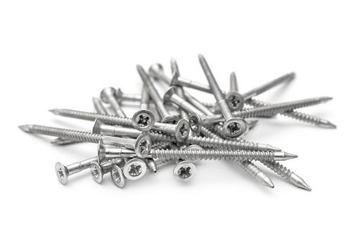 Heap of screws on white background.