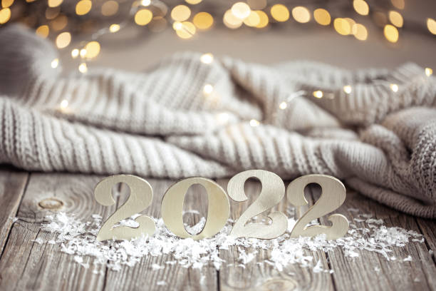 istock Cozy festive composition with the numbers 2022 on a wooden surface. 1348992702