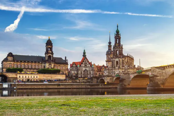 Photo of Augustus Bridge (Augustusbrucke) and Cathedral of the Holy Trinity (Hofkirche) over the River Elbe in Dresden, Germany, Saxony.