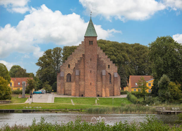 Maribo Cathedral or Domkirke with Hunså river in foreground