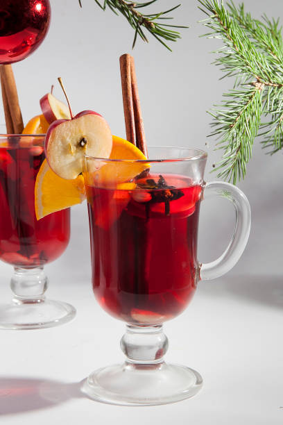 istock Two glass glasses with mulled wine on a winter background 1349004392